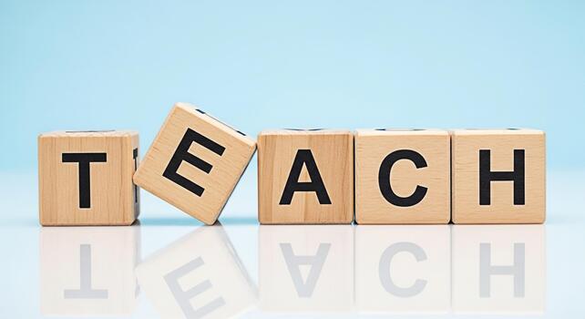 Wooden blocks spelling TEACH on a reflective surface against a light blue background symbolizing education learning and the importance of knowledge with a bright and optimistic mood photo