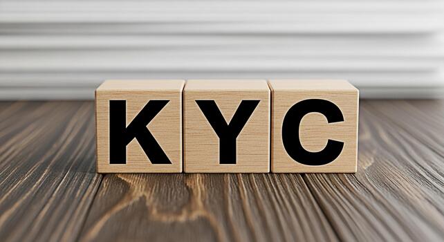 Wooden blocks displaying KYC on a dark wooden table representing the concept of Know Your Customer compliance in a business setting emphasizing trust and security in financial transactions photo