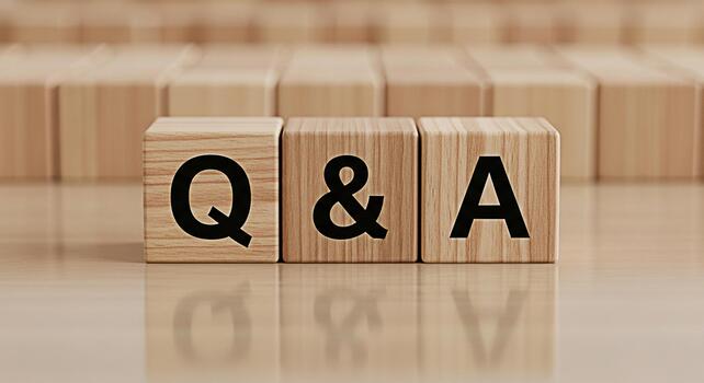 Wooden blocks displaying Q A on a reflective surface representing knowledge exchange and problemsolving in a learning environment fostering curiosity and understanding photo