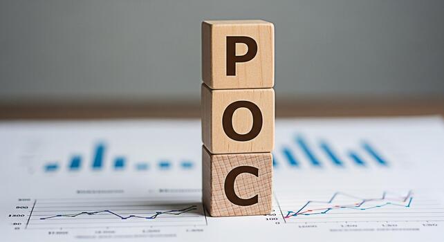 Wooden blocks spelling POC on a financial report representing Proof of Concept in a business setting symbolizing innovation and strategic planning for successful project validation and market analysis photo