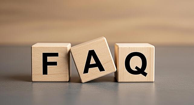 Wooden blocks displaying FAQ on a neutral surface representing frequently asked questions and information accessibility in a simple and clear presentation for customer support and business solutions photo