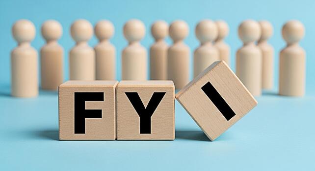 Wooden blocks displaying FYI in front of a group of wooden figures on a blue background representing information sharing communication and keeping people informed in a business or social context photo
