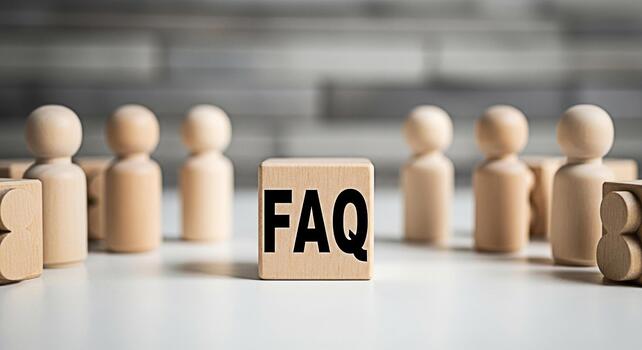 Wooden FAQ block standing prominently among a group of wooden figures on a white surface symbolizing information access and customer support in a minimalist and clean setting fostering a sense of clar photo