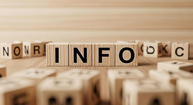 Wooden blocks spelling INFO on a wooden surface conveying a message of information and knowledge in a simple clean and educational setting perfect for business education and communication concepts photo