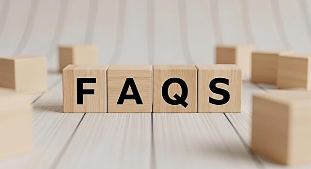 Wooden blocks spelling FAQs on a white wooden surface representing answers to common queries and providing information creating a helpful and informative atmosphere for viewers photo