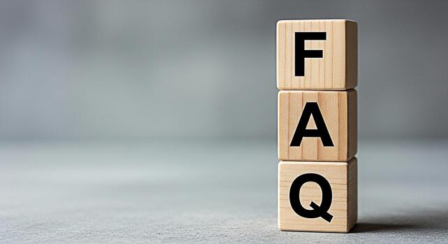 Wooden blocks displaying FAQ in a neutral studio setting representing answers to frequently asked questions and providing clarity and support to customers and website visitors fostering trust and tran photo