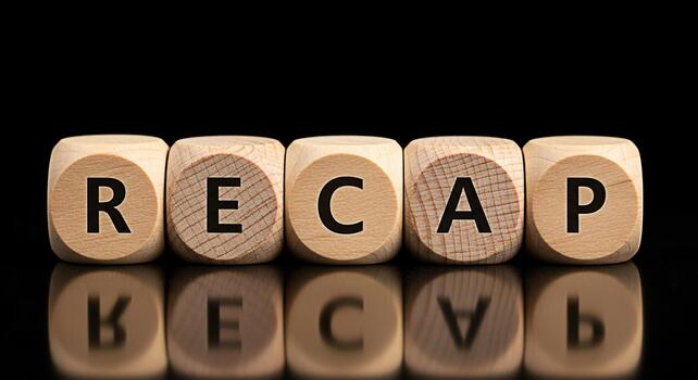 Wooden dice spelling RECAP on a reflective black surface symbolizing a summary and review of past events offering a sense of closure and understanding ideal for business reports and educational materi photo