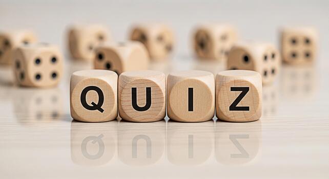 Wooden dice spelling QUIZ on a reflective surface suggesting a fun and engaging trivia game or knowledge test in a bright and clean environment creating a playful and educational atmosphere photo