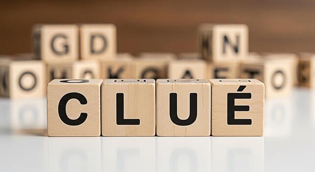 Wooden blocks spelling Clue on a white surface suggesting a mystery or puzzle to be solved creating a sense of intrigue and challenge perfect for educational or gamerelated content photo