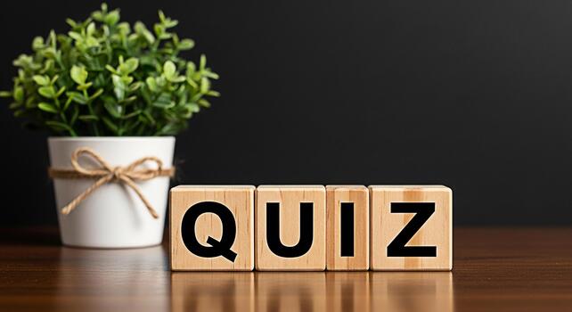Wooden blocks spelling QUIZ on a wooden table with a potted plant in the background representing a test of knowledge and skills in an educational and engaging environment photo