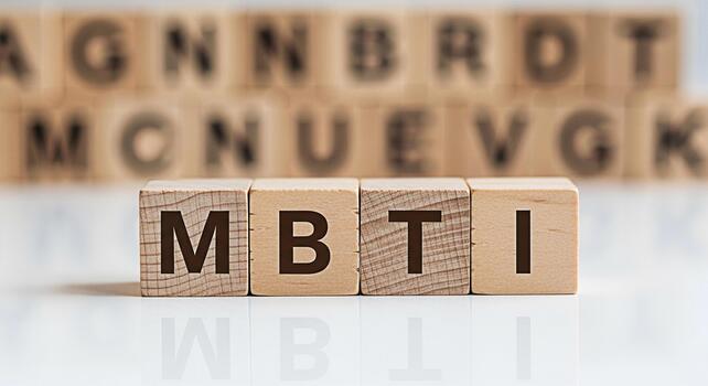 Wooden blocks displaying MBTI on a white surface representing personality assessment and psychological testing in a clinical or educational setting conveying concepts of selfawareness and understandin photo