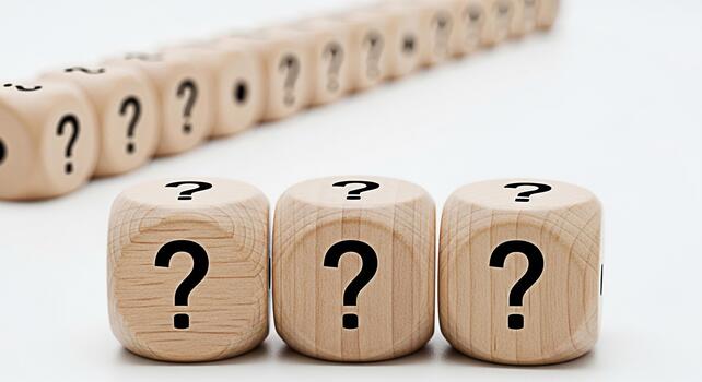 Wooden dice displaying question marks on a white surface symbolizing uncertainty and the need for answers in a clean and minimalist setting evoking curiosity and the search for solutions photo