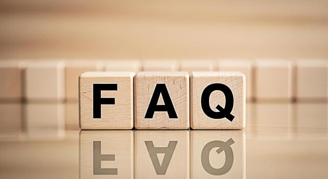 Wooden blocks spelling FAQ on a reflective surface symbolizing information access and problemsolving in a business or educational environment creating a sense of clarity and guidance photo