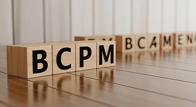 Wooden blocks spelling BCPM and BCAMENG on a shiny wooden surface representing business concepts and financial strategies in a corporate environment conveying a sense of order and precision photo