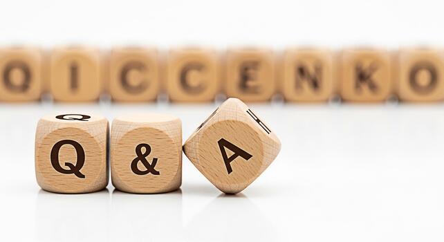 Wooden dice displaying QA on a white surface representing questions and answers in a clean minimalist setting conveying clarity and information for educational or business purposes photo