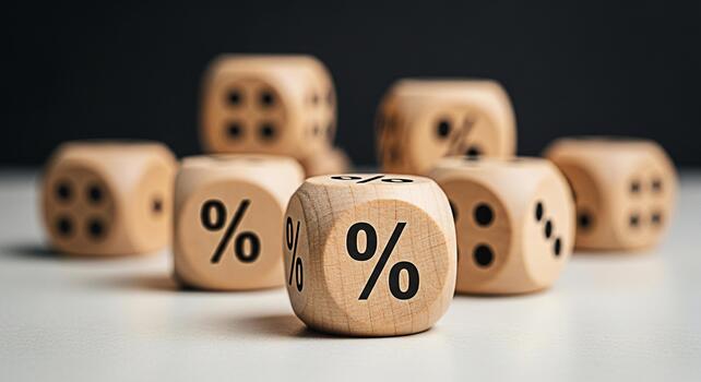 Wooden dice displaying percentage signs on a white surface symbolizing financial rates and interest in a neutral setting creating a sense of uncertainty and risk in business and investment decisions photo