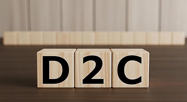Wooden blocks spelling D2C on a wooden table representing direct to consumer business model promoting a modern and innovative approach to sales and marketing in a conceptual and minimalist setting photo