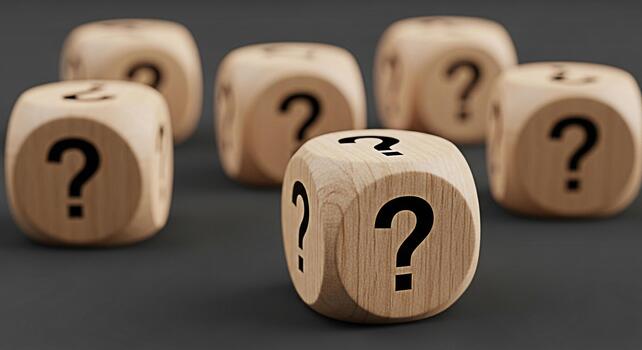 Wooden dice displaying question marks on a gray surface representing uncertainty and the search for answers in decisionmaking emphasizing the concept of risk and challenges in business and life photo
