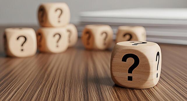 Wooden dice displaying question marks on a wooden table symbolizing uncertainty and the need for answers in business and life creating a mood of curiosity and problemsolving photo