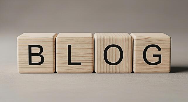 Wooden blocks spelling BLOG sitting on a neutral surface representing online content creation and sharing conveying a sense of information and connection in a digital world photo