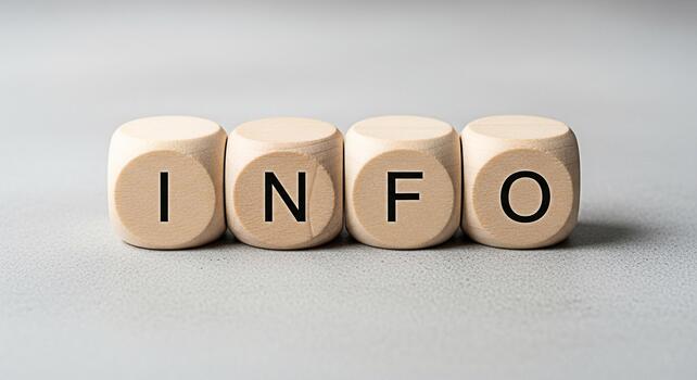 Wooden cubes spelling out INFO on a gray surface conveying information and knowledge in a simple clear and informative way ideal for educational or businessrelated content promoting transparency and u photo