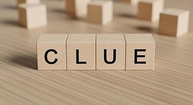 Wooden blocks spelling CLUE on a wooden surface suggesting a mystery to solve a puzzle to unravel or a hint to discover creating a sense of intrigue and anticipation photo