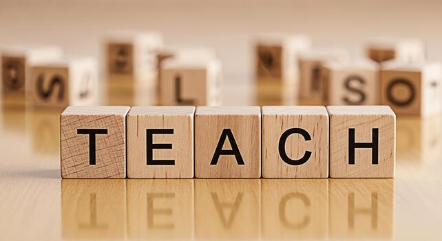 Wooden blocks spelling TEACH on a glossy surface surrounded by blurred letter blocks symbolizing education and the importance of teaching in a bright learningfocused environment conveying a sense of k photo