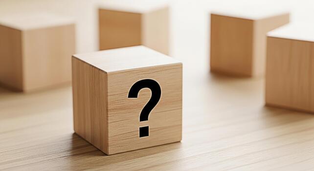 Wooden cube displaying a question mark on a bright wooden surface representing uncertainty curiosity and the search for answers in a minimalist and conceptual composition photo