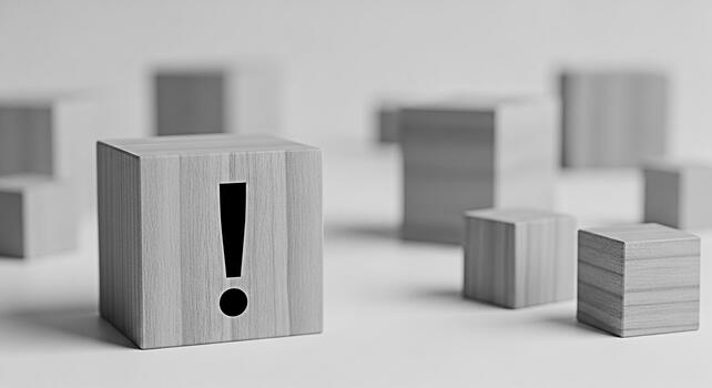 Wooden block displaying an exclamation mark stands out among other blocks on a white surface symbolizing attention warning and the importance of problemsolving in a minimalist and conceptual setting photo