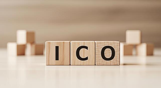 Wooden blocks spelling ICO on a light wooden surface representing Initial Coin Offering in a neutral setting symbolizing financial technology and investment opportunities with a clean and minimalist a photo