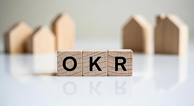 Wooden blocks displaying OKR in a bright setting symbolizing Objectives and Key Results for business goal setting and achievement fostering a focused and strategic approach to success photo