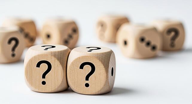 Wooden dice displaying question marks on a white surface symbolizing uncertainty and the need for answers in a complex decisionmaking process creating a sense of mystery and intrigue photo