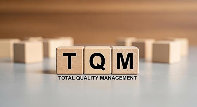Wooden blocks displaying TQM Total Quality Management on a neutral surface symbolizing a commitment to excellence and continuous improvement in a business environment fostering trust and reliability photo