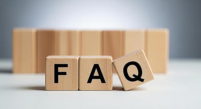 Wooden blocks displaying FAQ on a white surface representing frequently asked questions and information access conveying clarity and support in a simple minimalist setting for customer service photo