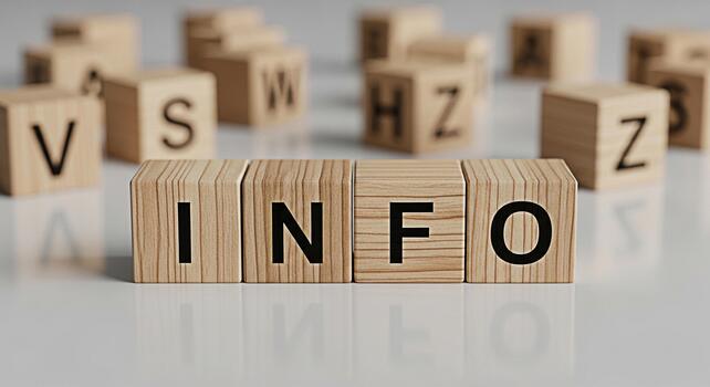 Wooden blocks spelling INFO on a white surface surrounded by other lettered blocks conveying a sense of knowledge and information dissemination in a clean minimalist setting photo
