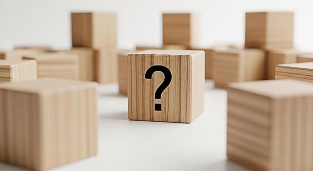Wooden cube displaying a question mark amidst a group of similar cubes on a white surface symbolizing uncertainty problemsolving and the search for answers in a minimalist and conceptual setting photo