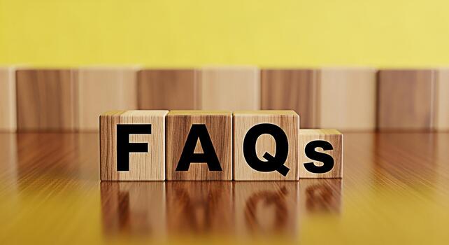 Wooden blocks spelling FAQs on a shiny wooden surface against a yellow background representing frequently asked questions and providing information creating a helpful and informative atmosphere photo
