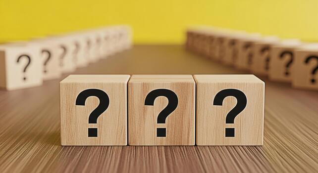Wooden blocks displaying question marks on a textured wooden surface symbolizing uncertainty and the need for answers in a business or educational context creating a sense of inquiry and problemsolvin photo