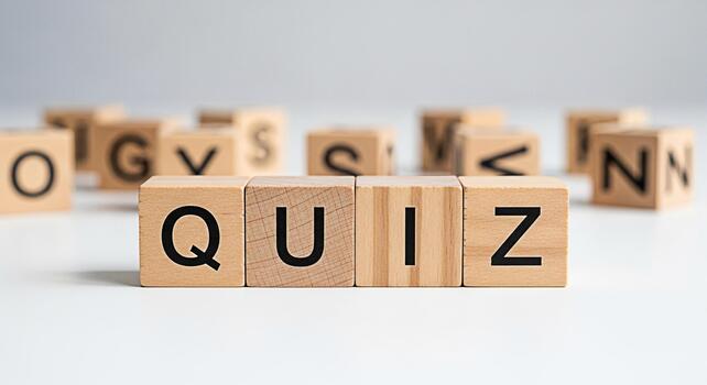 Wooden blocks spelling QUIZ on a white surface creating a playful and educational atmosphere for learning and testing knowledge perfect for online courses educational games and interactive content photo