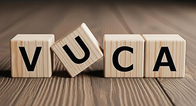 Wooden blocks spelling VUCA on a wooden surface representing Volatility Uncertainty Complexity and Ambiguity in a business environment symbolizing challenges and strategic planning for future success photo
