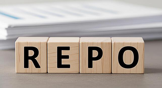 Wooden blocks spelling REPO on a gray surface with financial documents in the background representing repurchase agreements and shortterm borrowing in a professional and informative setting photo