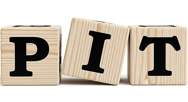Wooden blocks spelling PIT on a white surface representing challenges and obstacles in a simple minimalistic composition conveying a sense of adversity and the need for problemsolving photo