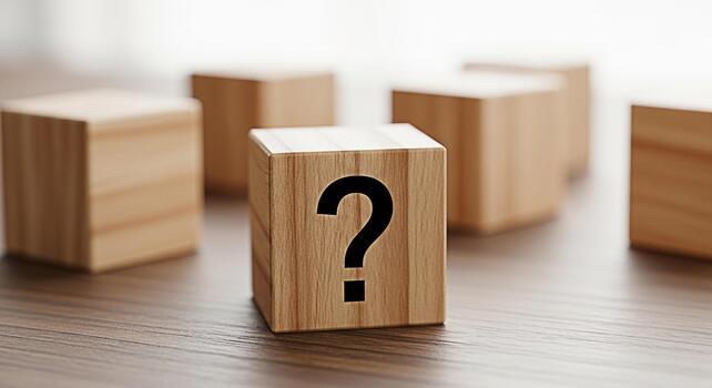 Wooden block displaying a question mark on a wooden surface surrounded by other blocks creating a sense of uncertainty and curiosity ideal for concepts related to problemsolving and decisionmaking photo