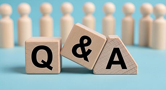 Wooden blocks displaying QA on a blue surface representing questions and answers in a business setting symbolizing knowledge sharing and problemsolving with a focus on collaboration and communication photo