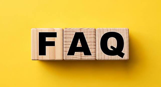 Wooden blocks displaying FAQ on a vibrant yellow background representing frequently asked questions and information resources creating a helpful and informative mood for online support and customer se photo