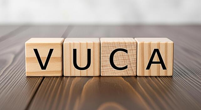 Wooden blocks spelling VUCA on a dark wooden surface representing Volatility Uncertainty Complexity and Ambiguity symbolizing the challenges of modern business and strategic planning in a dynamic envi photo