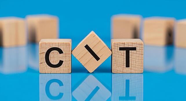Wooden blocks spelling CIT on a blue reflective surface representing the concept of technology and innovation in a clean modern setting ideal for illustrating digital transformation and IT solutions photo