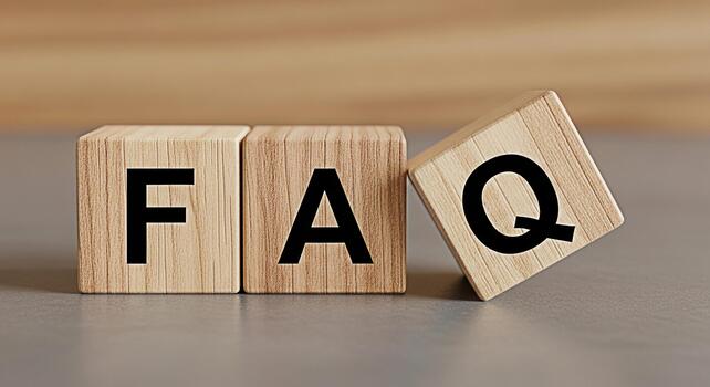 Wooden blocks displaying FAQ on a neutral surface representing frequently asked questions and information access conveying a sense of clarity and support for customers and users seeking answers photo