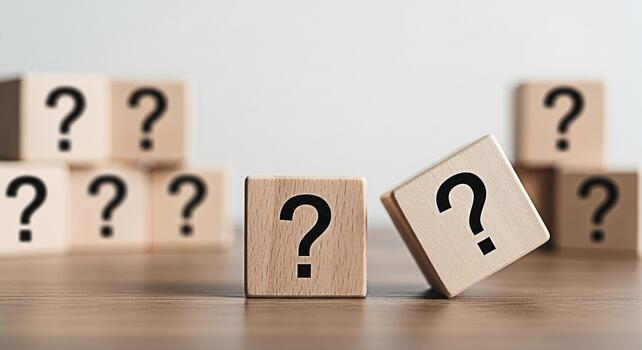 Wooden blocks displaying question marks on a wooden surface symbolizing uncertainty and the need for problemsolving in a bright minimalist studio environment creating a sense of curiosity and inquiry photo