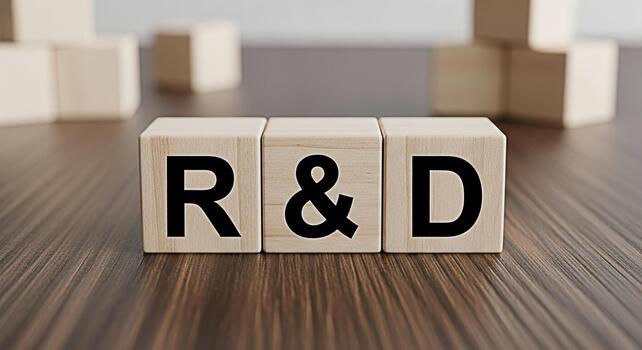 Wooden blocks spelling RD on a wooden surface representing research and development innovation and progress in a corporate setting conveying a message of growth and strategic planning photo